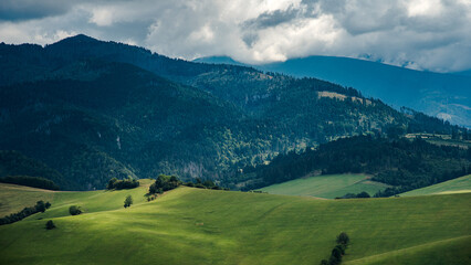 Fototapeta na wymiar Landscape photo of nature in Slovakia. Beautiful summer landscape. Tatra Mountains in background.