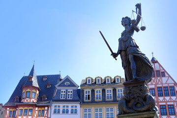 bronze sculpture on the fountain of justice depicts the Roman goddess Justitia in rays of light, popular attraction in Frankfurt am Main, concept of fair trial, the inevitability of retribution