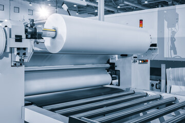 The operation of automatic plastic packaging production machine. roller of the polyethylene...