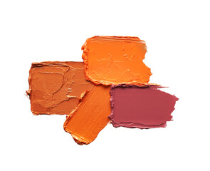 Smears of lip gloss bronze shades isolated on white background.