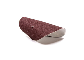 Sandpaper, one side of which is coated with an abrasive.