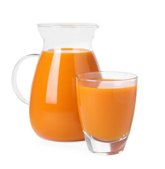 Glass and pitcher of carrot juice on white background