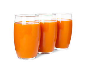 Three glasses of fresh carrot juice on white background