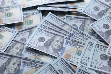 Dollar banknotes as background, closeup view. Money exchange