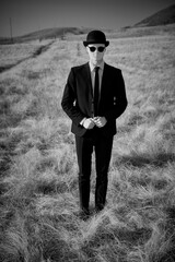 masked man in wild field