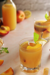 Glasses with peach juice cocktail	