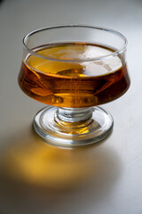 Glass of apple cider drink on white table, Normandy, France