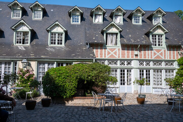 Old French houses in beautiful village Veules-les-Roses, tourists destination in Normandy, France