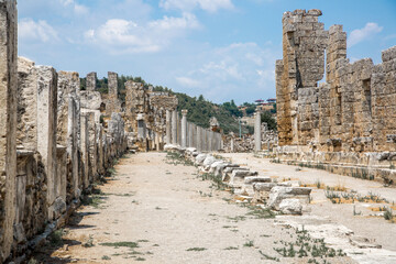 Fototapeta na wymiar Roman ruins. Colonnaded street of city Perge. Ancient Greek colony from 7th century BC, conquered by Persians and Alexander the Great in 334 BC. Turkey