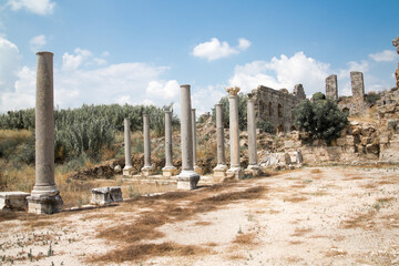 Fototapeta premium Roman ruins. Colonnaded street of city Perge. Ancient Greek colony from 7th century BC, conquered by Persians and Alexander the Great in 334 BC. Turkey