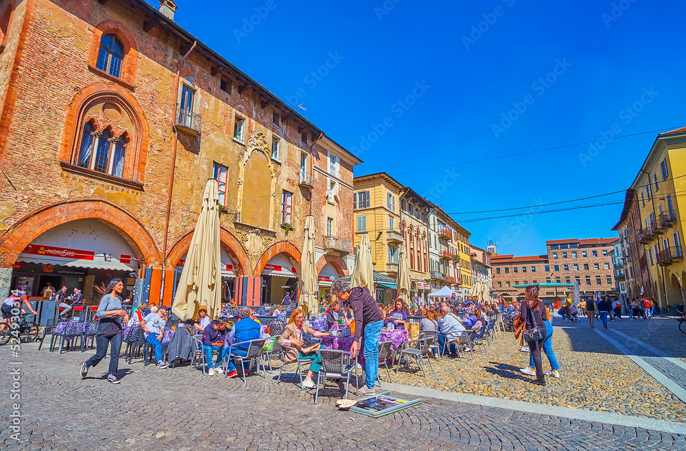 Canvas Prints Relax in one of outdoor restaurants on Piazza della Vittorio, the main tourist hub of the city Pavia, Italy