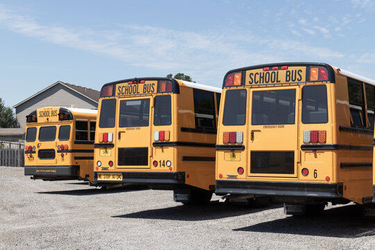 School Bus staging area waiting for students. School buses are an effective transportation method in rural districts.