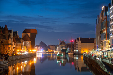 Fototapeta na wymiar Scenic summer evening panorama of the architectural embankment pier canal river illumination of the Old Town GDANSK, POLAND