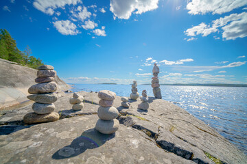 Pyramid of stones. Unstable balance of stone objects. Idyllic state of nature.