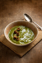 zucchinis soup with crusty bread and cream sauce