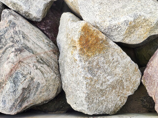 Large stones on the seashore. Stone close up background