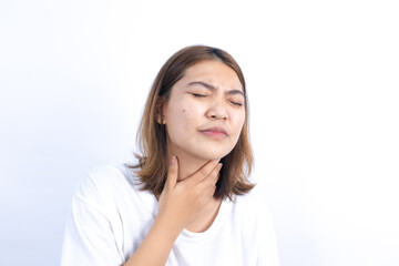 Asian woman has chronic sore throat from cold, health problems