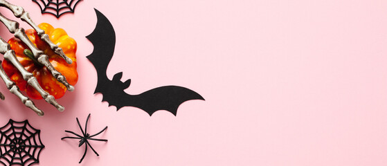 Halloween banner design. Pumpkin, spiders, bat on pastel pink background