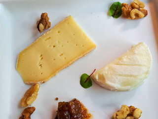 Cheese plate with walnuts and fig preserves