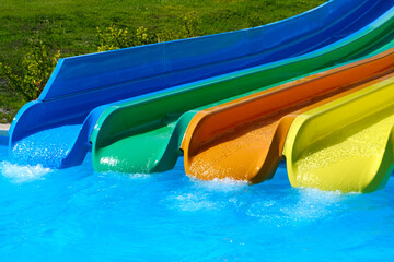 Colorful slides in the water park in summer