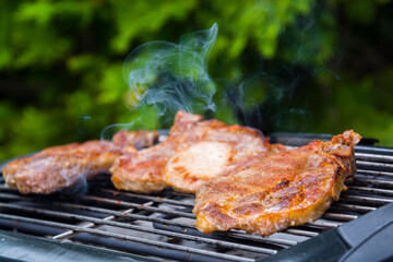 Baking grilled pork meat in the garden