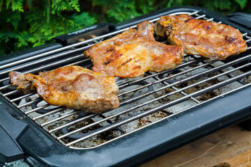 Baking grilled pork meat in the garden