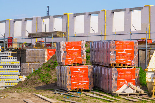 pallets with wienerberger facing bricks on a consturction site, Building materials, construction site in Rucphen, The Netherlands, 6 may, 2022