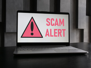 Scam alert is shown using the text