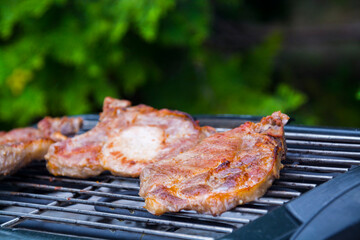 Baking grilled pork meat in the garden