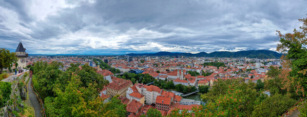 Cityscape of old town of Graz and the Clock Tower (Grazer Uhrturm), famous tourist attraction in...