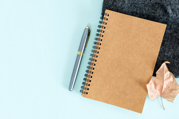 Pen and notepad on a table.