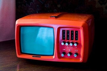 Small and retro tv in dark environment