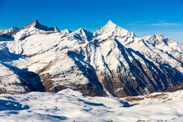 View of the picturesque mountain peaks in winter, located near the popular resort of Zermatt, Switzerland