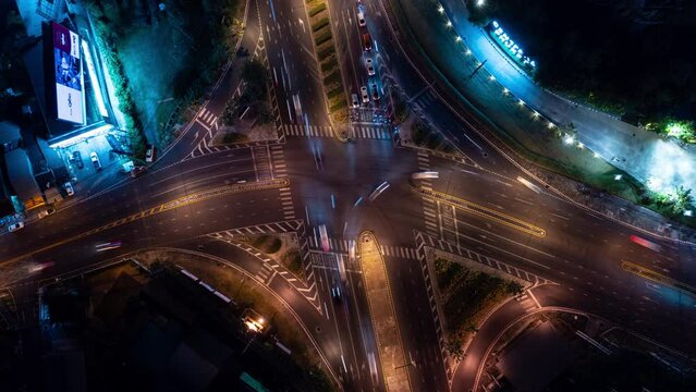 night time illumination phuket island city traffic street crossroad aerial topdown panorama 4k timelapse thailand 