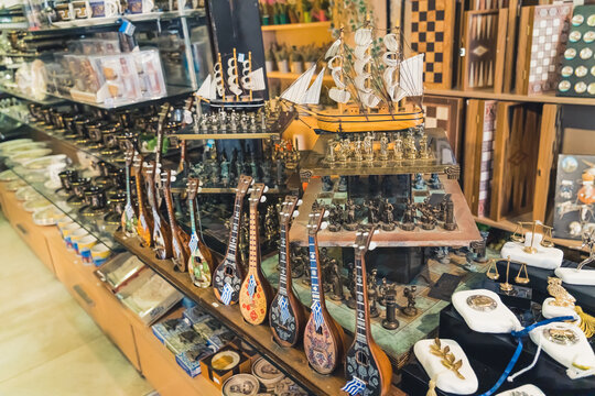 01.15.2021 Thessaloniki, Greece. Famous Kapani Market offers not only for, but also various souvenirs for traveling tourists. Wooden ships, mini guitars on the display. High quality photo