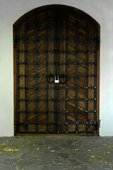 Old front door. Antique wood and steel door. medieval door