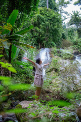 A vacation to a waterfall in the middle of the forest in the high valley.