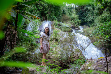 A vacation to a waterfall in the middle of the forest in the high valley.