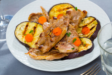 Delicious grilled marinated mutton chops with roasted eggplant and carrot