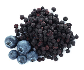 Sweet sublimated and fresh blueberries on white background, top view