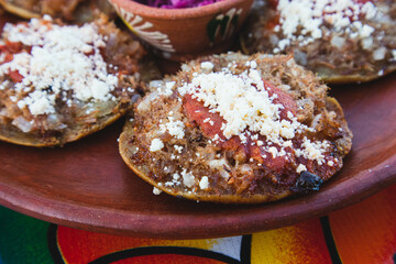 A plate of Garnachas on a table at an Oaxacan restaurant in Oaxaca City, Mexico.