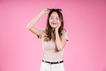 Excited success achievement and glad celebrating of Happy asian young woman confident smiling on the pink background