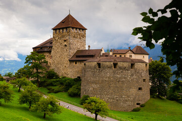 Fototapeta na wymiar Vaduz castle with Alps mountains in background. Liechtenstein