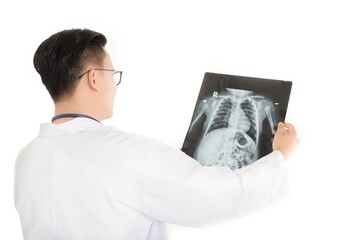 Asian doctor looking baby patient film, body x-ray, supine position
