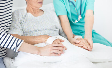doctor and caregiver talk with old asian patient about disease symptom , elderly health care , hand in hand, they  holding hand of patient, mother day - obrazy, fototapety, plakaty