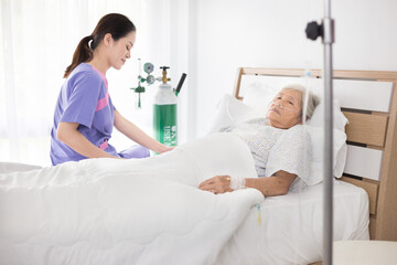 nurse screening old asian patient , elderly health check up , palliative care