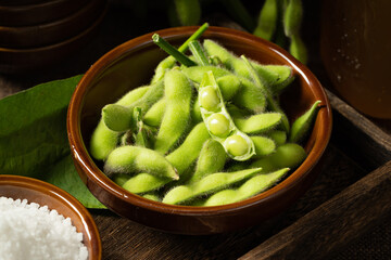 Fresh edamame on a wooden plate