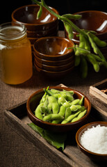 Fresh edamame on a wooden plate