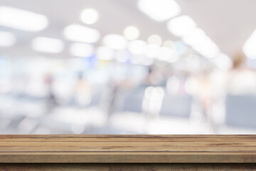 Empty wooden table anb Abstract blur airport interior for backgounrd