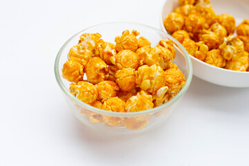 Honey caramel popcorn on white background.